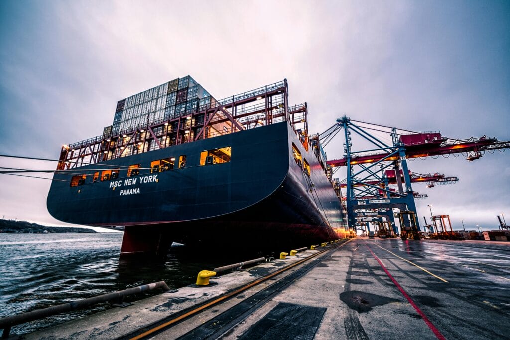 pexels-photo-906982-906982 A large cargo ship docked at Gothenburg port with industrial cranes, Sweden.